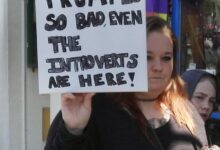 Protesters hug, chant, wave at counter protesters and act “square” at huge Fort Bragg protest